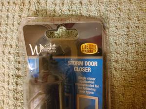 lot 57 image: Storm door closer kit, and hose splitter