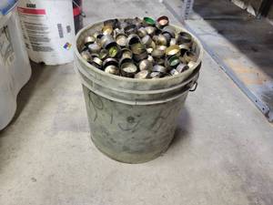 lot 199 image: Bucket full of Brass Freeze Plugs
