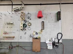 lot 43 image: Contents of Pegboard - Lockout Tags, BOSCH Tags, Gaskets  Peg Hooks from (5) Pegboards