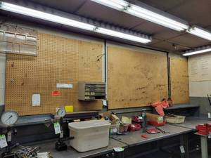 lot 277 image: (3) Sheets of Pegboard and Peg Hooks on Wall - Includes Boards Numbered 16,17,18 - Bring tools to Remove