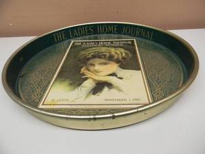 lot 53 image: VINTAGE THE LADIES HOME JOURNAL METAL SERVING TRAY - COOL PIECE - APPROX 14 - SEE PICTURES