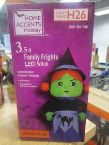 lot 370 image: Home Accents Holiday 3.5 ft Green Witch With Cat Apron Halloween Inflatable (OPEN BOX)