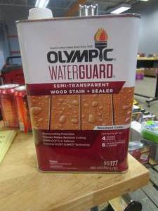 lot 395 image: Olympic Waterguard Waterproof Wood Deck Sealer, 1 Gallon (CAN IS DENTED)