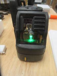 lot 79 image: DEWALT 165 ft. Green Self-Leveling Cross Line Laser Level with (3) AAA Batteries & Case, DW088CG - SOLD AS IS