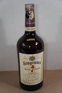lot 215 image: Vintage Seagrams 7 Crown Glass 1 Gallon Whiskey Bottle