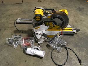lot 2 image: Dewalt 15 Amp Corded 12 in. Double Bevel Sliding Compound Miter Saw customer return see pictures
