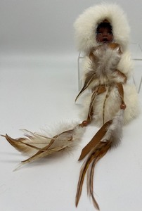 lot 1101 image: Baby in Fur Papus and Faux Peace Pipes
