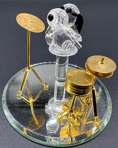 lot 1236 image: Vintage Swarovski Crystal Snoopy Figurine Playing the Drums - Vintage Joe Cool Swarovski Figurine