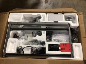 lot 54 image: RIDGID 7 In Wet Tile Saw with Stand open Box see pictures