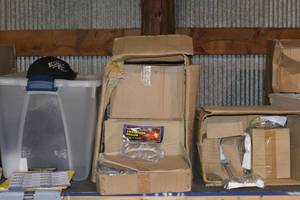 2 boxes of safety glasses and container of caps