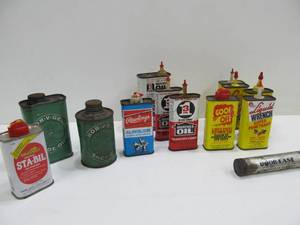 lot 38 image: Group of Small Advertising Oil Cans