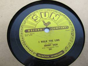 lot 104 image: Vintage JOHNNY CASH Vinyl SUN Record - I Walk the Line & Get Rhythm