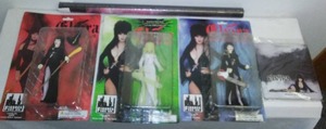 Elvira Mistress of the Dark action figures, poster and wallet. All New