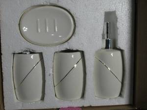 lot 25 image: Piper & Home 4 piece bath set in white with gold highlights