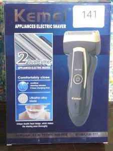 lot 141 image: Kemei KM - 858 Men Reciprocating Electric Travel Use Safe Shaver, Black and Gold