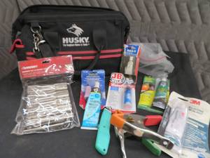 lot 36 image: CANVAS HUSKY TOOL BAG FULL OF GOODIES.