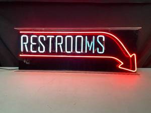lot 44 image: Restrooms with arrow neon sign