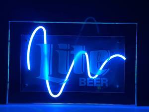 lot 96 image: Lite Beer Wave neon, framed and mounted on black plexi