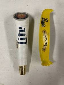 lot 219 image: Lot of 2 tap handles Leinies and Miller