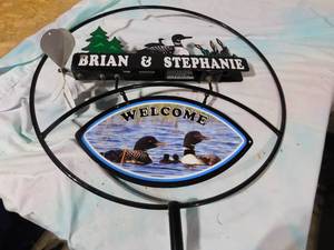 lot 100 image: loon welcome sign