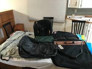 lot 305 image: 2 sports bag and 2 suitcases (1 lucas and one is leather)