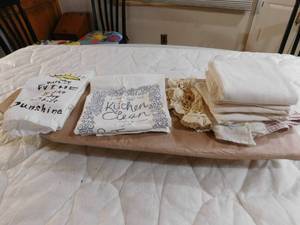 lot 53 image: Dish towels and doilie and ironing board