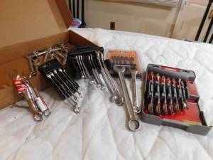 lot 19 image: box of wrenches and warrior drill bits