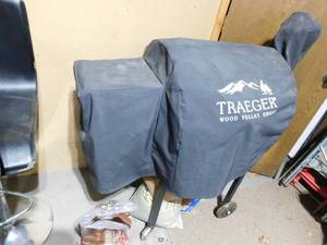 lot 163 image: Treger wood pellet grill w cover and wood pellets