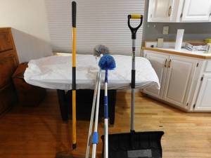 lot 137 image: Shovel, rake and long handled brushes