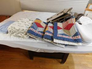 lot 318 image: quilted pillow cases, Eddie bauer top flannel sheet, rugs, hanging organiser and more