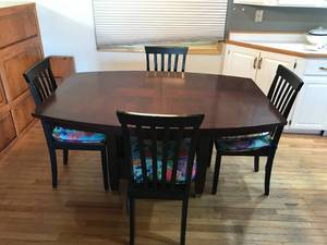 lot 325 image: wood Dining room table with 4 chairs and cushions