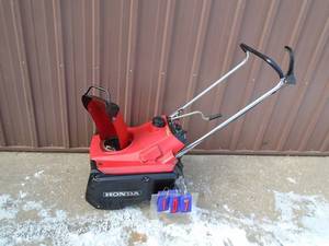 Honda 4 cycle snow thrower. Used condition. Tested & works. As shown.
