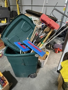 lot 97 image: Garbage Can with Brooms, Rakes, and More