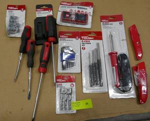 Lot of tools - screwdrivers, punches, soldering iron, box cutters, laser distance measurer