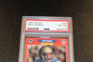 lot 57 image: 1989 Pro Set Troy Aikman #490 Rookie Card PSA 8