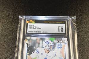 lot 206 image: 2021 Score Zach Wilson #304 Rookie Card CSG 10
