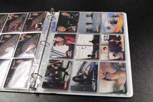 lot 280 image: 1997 Inkworks James Bond Tomorrow Never Dies Set In BinderPages  90 Card Set