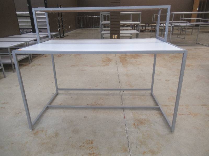 Steel Table With Steel Frame and Removable Top Display Shelf, Approximate Dimensions 60 x 36 x 49 Tall. Slight Scratch and Dent.
