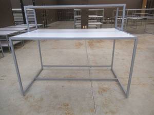 Steel Table With Steel Frame and Removable Top Display Shelf, Approximate Dimensions 60 x 36 x 49 Tall. Slight Scratch and Dent.