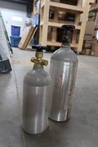 TWO SMALL C02 TANKS