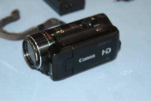 lot 134 image: Canon VIXIA HF10 High Definition HD 12x Optical Zoom Camcorder  Camera with 2.7 Viewfinder Extra Batteries & More