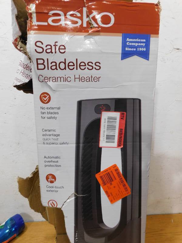 lot 97 image: New - Lasko Bladeless 1500-Watt 28 in. Electric Oscillating Tower Ceramic Space Heater with Remote Control