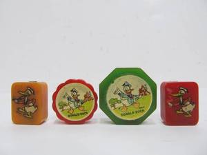 lot 216 image: 4 Different 1930s Bakelite Donald Duck Pencil Sharpeners