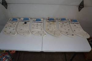 lot 35 image: 6 Antique White Christmas Stockings