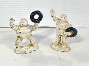 lot 28 image: Lot of 2 Cast Iron Michelin Man Figures 3  Inch Tall