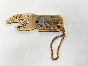 lot 29 image: You Pay Coca Cola Brass Bottle Opener