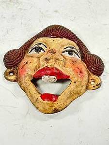 lot 82 image: Crazy Eyed Lady Cast Iron Bottle Opener