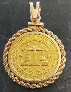 110th TROY OZ .999 FINE GOLD IN GOLD BEZEL
