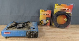 lot 119 image: Coleman Portable Camp Stove, Mr. Heater 18 Propane Acme Flexible Pigtail Hose Assembly and Mr. Heater 15 Propane Appliance Extension Hose Assembly F