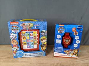 lot 155 image: Paw Patrol 8-Book Library and Electronic Reader and VTech Paw Patrol Marshall Learning Watch  M